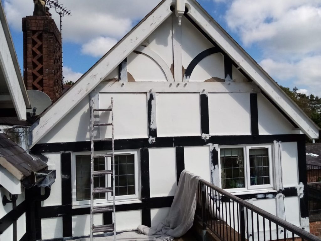 Our painters and decorators painting Tudor house front.