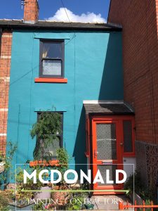 Terraced house in Chester painted orange and teal by McDonald Painting Contractors Ltd.